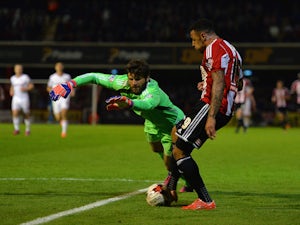 Andre Gray of Brentford scores their first goal during the Sky Bet Championship Playoff Semi-Final between Brentford and Middlesbrough at Griffin Park on May 8, 2015