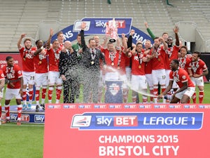 Bristol City players celebrate their League One championship win on May 4, 2015