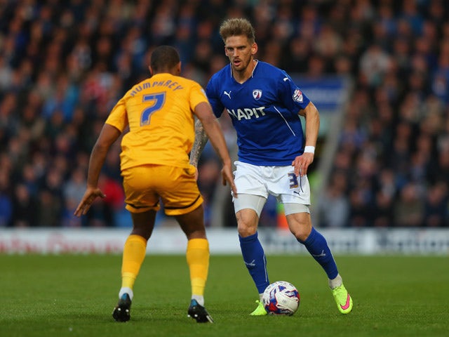 Daniel Jones of Chesterfield takes on Chris Humphrey of Preston North End during the Sky Bet League One Playoff Semi-Final, first leg match between Chesterfield and Preston North End at the Proact Stadium on May 7, 2015