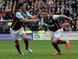 Burnley's English striker Danny Ings (R) celebrates scoring his goal with team mate Burnley's Scottish midfielder George Boyd during the English Premier League football match between Hull City and Burnley at the KC Stadium in Kingston upon Hull, north eas