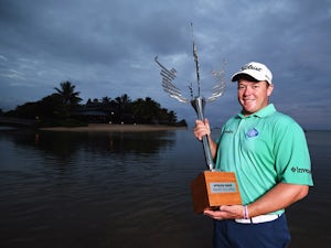 George Coetzee of South Africa with the trophy after winning the AfrAsia Bank Mauritius Open at Heritage Golf Club on May 10, 2015