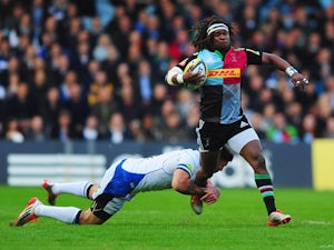 Marland Yarde of Harlequins is tackled by Matt Banahan of Bath Rugby during the Aviva Premiership match between Harlequins and Bath Rugby at Twickenham Stoop on May 8, 2015