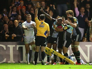 Ugo Monye of Harlequins is mobbed by team mates after scoring his second try during the Aviva Premiership match between Harlequins and Bath at the Twickenham Stoop on May 8, 2015