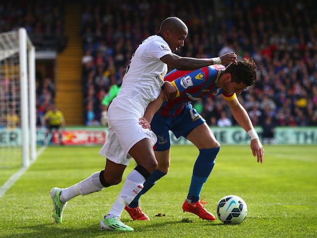 Joel Ward of Crystal Palace is challenged by Ashley Young of Manchester United during the Barclays Premier League match between Crystal Palace and Manchester United at Selhurst Park on May 9, 2015