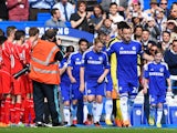 Captain John Terry of Chelsea leads out his team through a guard of honour by the Liverpool players during the Barclays Premier League match between Chelsea and Liverpool at Stamford Bridge on May 10, 2015 