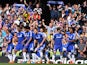 Chelsea players and fans celebrate the opening goal scored by Chelsea's English defender John Terry (C) during the English Premier League football match between Chelsea and Liverpool at Stamford Bridge in London on May 10, 2015