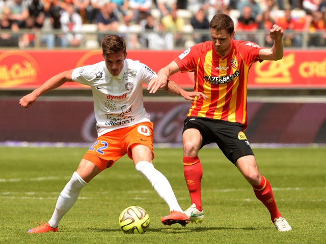 Lens' French midfielder Alharbi El Jadeyaoui vies with Montpellier's French midfielder Benjamin Stambouli during the French Ligue 1 football match Lens vs Montpellier at the Licorne stadium in Amiens on May 10, 2015