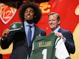 Leonard Williams of the USC Trojans holds up a jersey with NFL Commissioner Roger Goodell after being chosen #6 overall by the New York Jets during the first round of the 2015 NFL Draft at the Auditorium Theatre of Roosevelt University on April 30, 2015