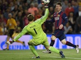 Barcelona's Argentinian forward Lionel Messi (R) scores a goal during the UEFA Champions League football match FC Barcelona vs FC Bayern Muenchen at the Camp Nou stadium in Barcelona on May 6, 2015
