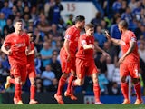 Liverpool captain Steven Gerrard celebrates with teammates after equalising for his side against Chelsea at Stamford Bridge on May 10, 2015