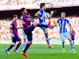 Luis Suarez of FC Barcelona competes for the ball with Inigo Martinez of Real Sociedad de Futbol during the La Liga match between FC Barcelona and Real Sociedad de Futbol at Camp Nou on May 9, 2015