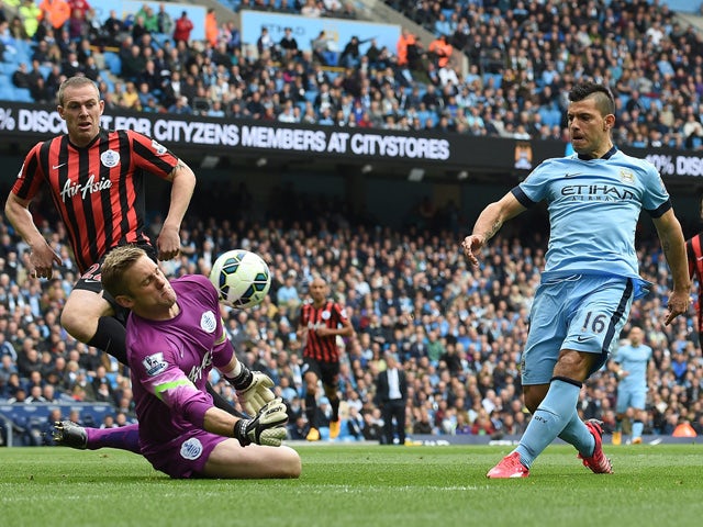 Manchester City's Argentinian striker Sergio Aguero shoots to score during the English Premier League football match between Manchester City and Queens Park Rangers at the Etihad Stadium in Manchester, northwest England, on May 10, 2015