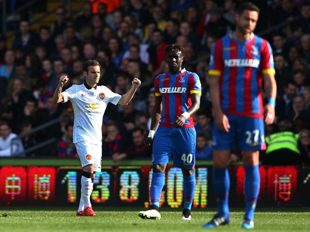Juan Mata of Manchester United celebrates scoring his penalty during the Barclays Premier League match between Crystal Palace and Manchester United at Selhurst Park on May 9, 2015