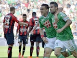 Saint-Etienne's French forward Melvut Erding (2nd R) and Saint-Etienne French defender Loic Perrin (R) celebrate after scoring a goal during the French L1 football match between Saint-Etienne and Nice on May 10, 2015