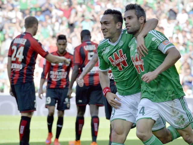 Saint-Etienne's French forward Melvut Erding (2nd R) and Saint-Etienne French defender Loic Perrin (R) celebrate after scoring a goal during the French L1 football match between Saint-Etienne and Nice on May 10, 2015