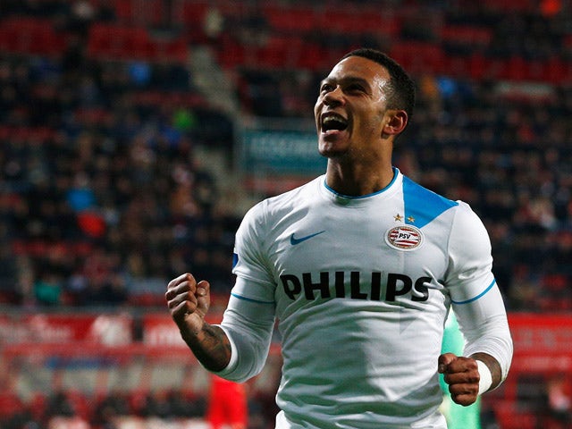Memphis Depay of PSV celebrates after he scores the fifth goal of the game for his team during the Dutch Eredivisie match between FC Twente and PSV Eindhoven held at De Grolsch Veste Stadium on April 4, 2015