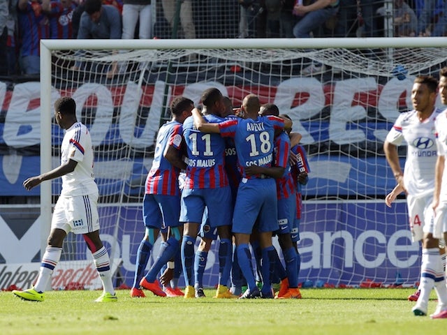 Caen players celebrates after French forward Nicolas Benezet scored during the French L1 football match between Caen and Lyon at the Michel d'Ornano stadium, in Caen, northwestern France on May 9, 2015