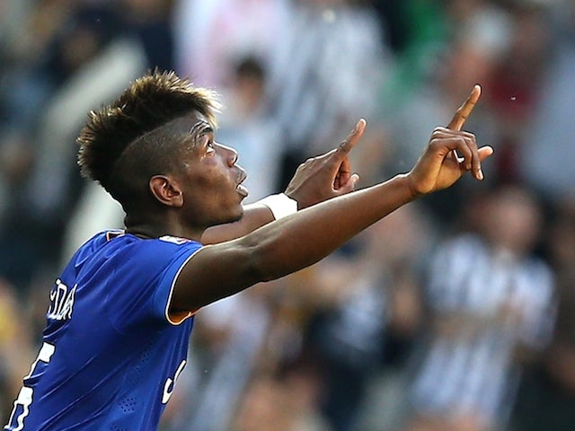 French midfielder Paul Pogba celebrates after scoring during the Italian Serie A football match between Juventus andCagliari on May 9, 2015