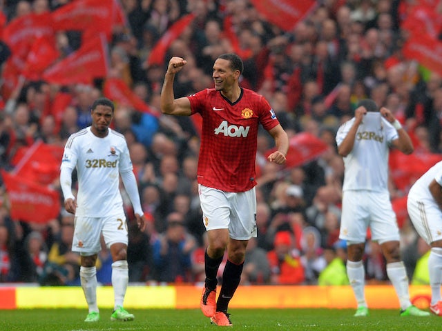 Manchester United's English defender Rio Ferdinand celebrates scoring his team's second and winning goal during the English Premier League football match between Manchester United and Swansea City at Old Trafford in Manchester, northwest England, on May 1