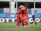 Roberto Soriano of UC Sampdoria is mobbed by team mates after scoring his team's second goal during the Serie A match between Udinese Calcio and UC Sampdoria at Stadio Friuli on May 10, 2015