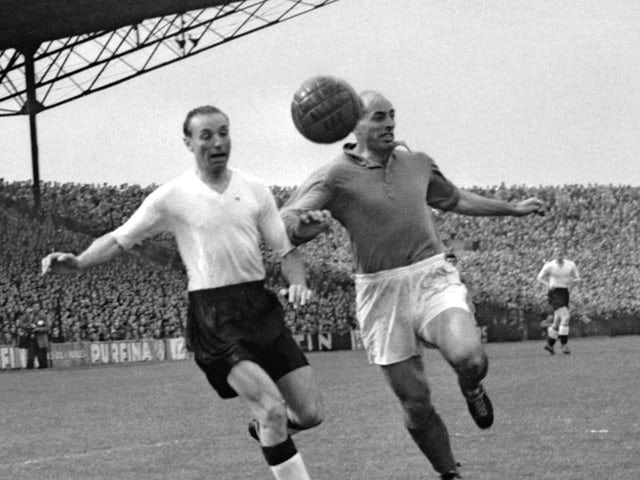 English forward Stanley Matthews and French defender Roger Marche run after the ball during the soccer match between France and England 13 May 1955 