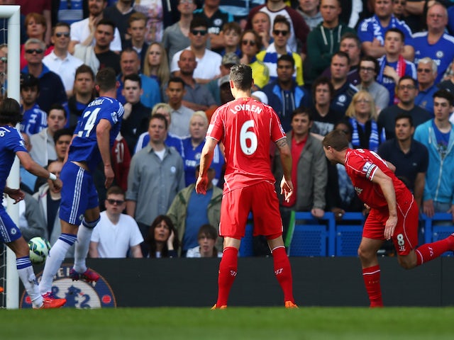 Steven Gerrard (R) of Liverpool scores a goal to level the scores at 1-1 during the Barclays Premier League match between Chelsea and Liverpool at Stamford Bridge on May 10, 2015