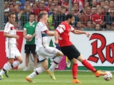 Freiburg's Swiss forward Admir Mehmedi (R) scores the 1-1 during the German first division Bundesliga football match SC Freiburg vs FC Bayern Munich in Freiburg, southern Germany, on May 16, 2015