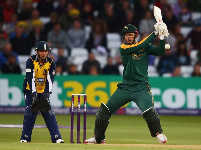 Alex Hales of Nottinghamshire hits the ball towards the boundary, as Tim Ambrose of Warwickshire looks on during the NatWest T20 Blast match between Nottinghamshire and Warwickshire at Trent Bridge on May 15, 2015