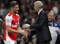Arsenal's Olivier Giroud shakes hands with boss Arsene Wenger on May 11, 2015