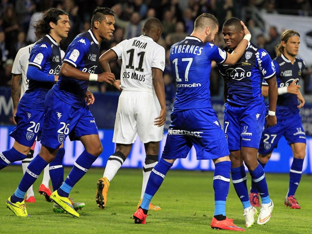 Bastia's French midfeilder Floyd Ayite is congratulated by teammates after scoring a goalduring the French L1 football match between Bastia and Caen on May 16, 2015