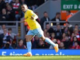 Crystal Palace's English midfielder Jason Puncheon celebrates scoring the 1-1 equalising goal from a free kick during the English Premier League football match between Liverpool and Crystal Palace at the Anfield stadium in Liverpool, northwest England, on