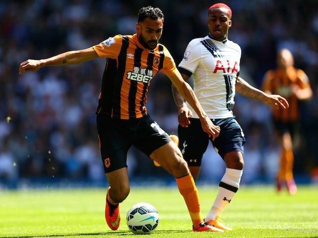 Danny Rose of Spurs closes down Ahmed Elmohamady of Hull City during the Barclays Premier League match between Tottenham Hotspur and Hull City at White Hart Lane on May 16, 2015