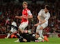 Nacho Monreal of Arsenal looks on as David Ospina of Arsenal makes a save at the feet of Ki Sung-Yueng of Swansea City during the Barclays Premier League match between Arsenal and Swansea City at Emirates Stadium on May 11, 2015