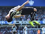 Newcastle United's French striker Emmanuel Riviere celebrates after scoring the opening goal during the English Premier League football match between Queens Park Rangers and Newcastle United at Loftus Road in London on May 16, 2015