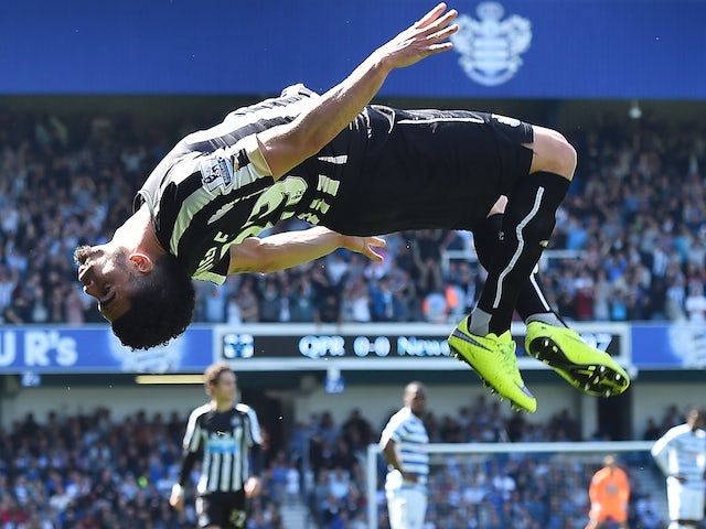 Newcastle United's French striker Emmanuel Riviere celebrates after scoring the opening goal during the English Premier League football match between Queens Park Rangers and Newcastle United at Loftus Road in London on May 16, 2015