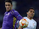 Fiorentina's Argentinian defender Gonzalo Rodriguez (L) vies for the ball with Sevilla's Colombian forward Carlos Bacca during the UEFA Europa League second leg semi-final football match Fiorentina vs Sevilla at the Artemio Franchi Stadium in Florence on 