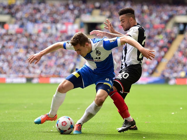 Tom Lockyer of Bristol Rovers holds off Nathan Arnold of Grimsby Town during the Vanarama Conference Playoff Final match between Grimsby Town and Bristol Rovers at Wembley Stadium on May 17, 2015