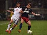 Juraj Kucka (L) of Genoa CFC is challenged by Marco Benassi of Torino FC during the Serie A match between Genoa CFC and Torino FC at Stadio Luigi Ferraris on May 11, 2015
