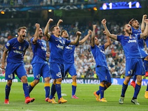 Juventus players celebrate following their progression to the final during the UEFA Champions League Semi Final, second leg match between Real Madrid and Juventus at Estadio Santiago Bernabeu on May 13, 2015