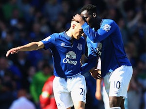 Leon Osman of Everton is congratulated by Romelu Lukaku of Everton on scoring their first goal during the Barclays Premier League match between West Ham United and Everton at Boleyn Ground on May 16, 2015
