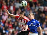 Connor Wickham of Sunderland and Marc Albrighton of Leicester City compete for the ball during the Barclays Premier League match between Sunderland and Leicester City at Stadium of Light on May 16, 2015