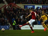 Michael Smith of Swindon Town scores from a penalty during the Sky Bet League 1 Playoff Semi-Final between Swindon Town and Sheffiled United at County Ground on May 11, 2015