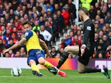 Olivier Giroud of Arsenal is faced by David De Gea of Manchester United as he misses a chance during the Barclays Premier League match between Manchester United and Arsenal at Old Trafford on May 17, 2015