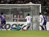 Carlos Bacca #9 of FC Sevilla scores the opening goal during the UEFA Europa League Semi Final match between ACF Fiorentina and FC Sevilla on May 14, 2015