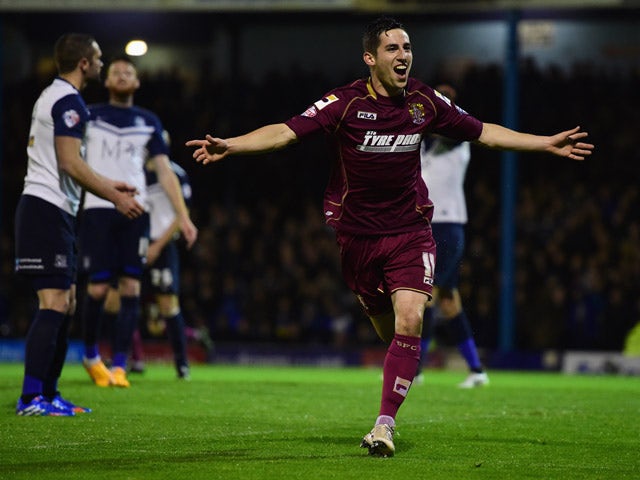 Tom Pett of Stevenage celebrates as he scores their first goal during the Sky Bet League Two Playoff semi final match between Southend United and Stevenage at Roots Hall on May 14, 2015