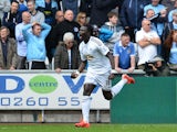 Swansea City's French striker Bafetimbi Gomis celebrates scoring an equalising goal to level the score 2-2 during the English Premier League football match between Swansea City and Manchester City at The Liberty Stadium in Swansea, south Wales on May 17, 