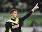Timo Horn raises his hand during the German first division Bundesliga football match VfL Wolfsburg vs 1 FC Koln at the Volkswagen Arena in Wolfsburg, central Germany on December 20, 2014