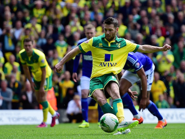 Wes Hoolahan of Norwich City scores their first goal from the penalty spot during the Sky Bet Championship Playoff semi final second leg match between Norwich City and Ipswich Town at Carrow Road on May 16, 2015