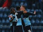 Alfie Mawson of Wycombe Wanderers (26) celebrates with team mates as he scores their second goal during the Sky Bet League Two Playoff semi final match between Wycombe Wanderers and Plymouth Argyle at Adams Park on May 14, 2015
