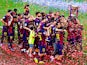 FC Barcelona players celebrate with La Liga trophy at the end of the La Liga match between FC Barcelona and RC Deportivo de la Coruna at Camp Nou on May 23, 2015